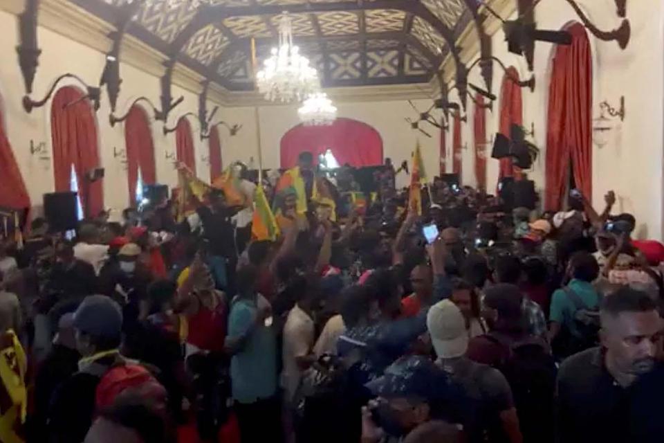 Demonstrators protest inside the PresidentÕs House, after President Gotabaya Rajapaksa fled, amid the country's economic crisis, in Colombo, Sri Lanka, in this screengrab obtained from social media video on July 9, 2022. News Cutter via