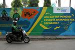 MURAL SOSIALISASI PENTINGNYA MENJADI PESERTA BPJAMSOSTEK