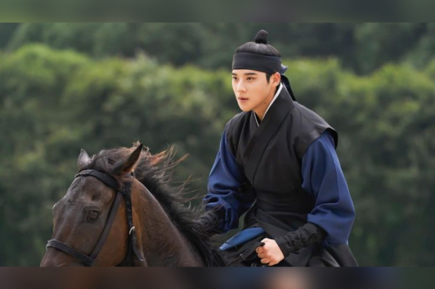 Under the Queens Umbrella