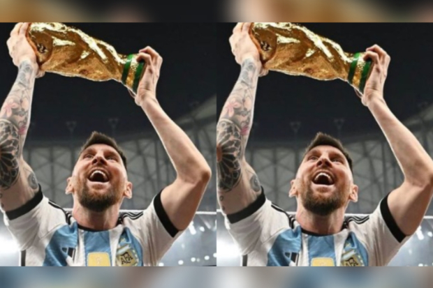 Lionel Messi berpose dengan trofi Piala Dunia