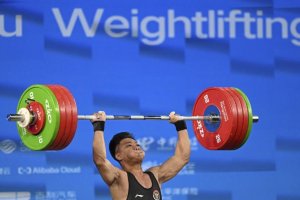 Lifter Indonesia Rahmat Erwin Abdullah berhasil menyabet medali emas sekaligus mencetak rekor dunia kelas 73 kilogram pada Asian Games 2022 Hangzhou, 