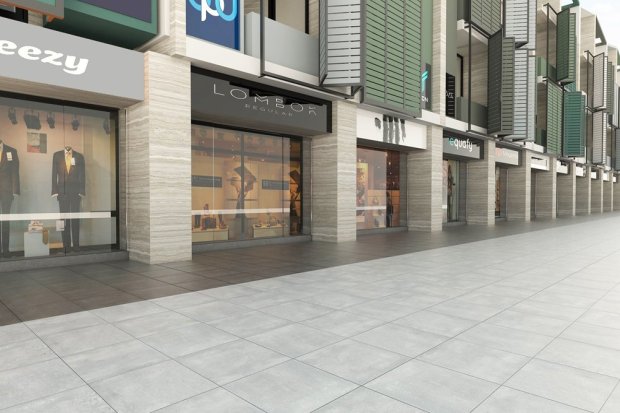 Area outdoor bangunan komersial dapat dipercantik dengan menggunakan ubin granit bernuansa batu alam.