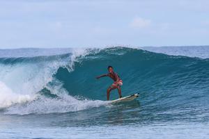 Bermain selancar saat musim ombak di Manokwari