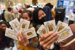 Harga emas Antam turun