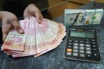 Nilai tukar rupiah ditutup melemah ke level Rp18.109 per dolar AS (Foto: Katadata/Fauza Syahputra)