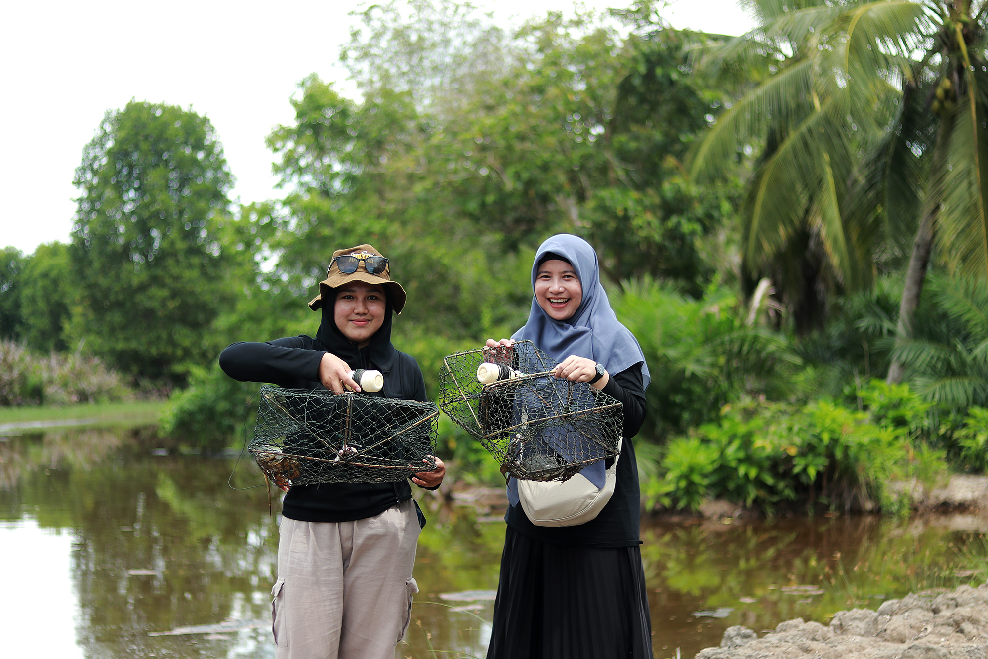 Visitors are showing off their catch of mud crabs