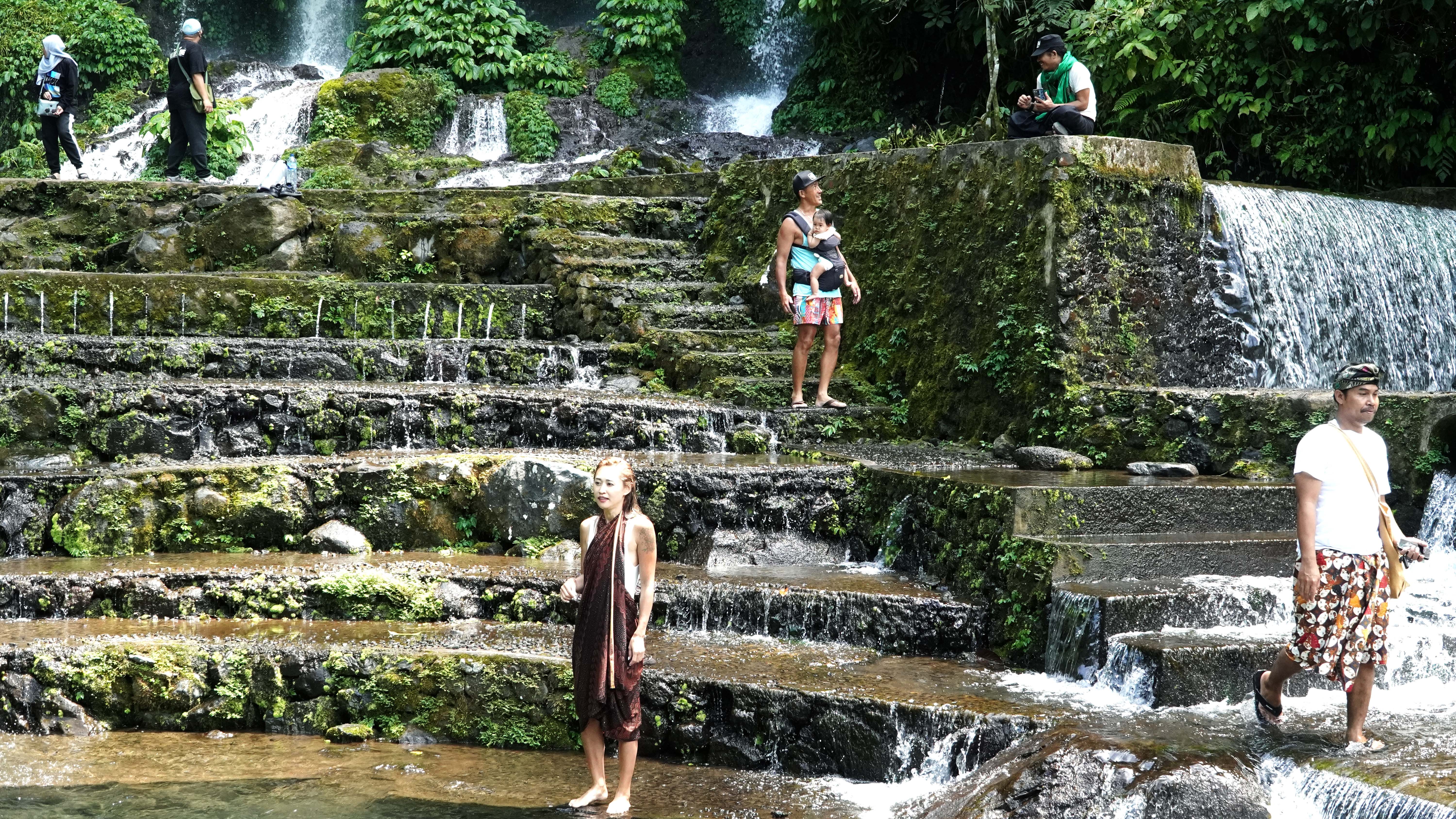 four people wearing fringed clothes